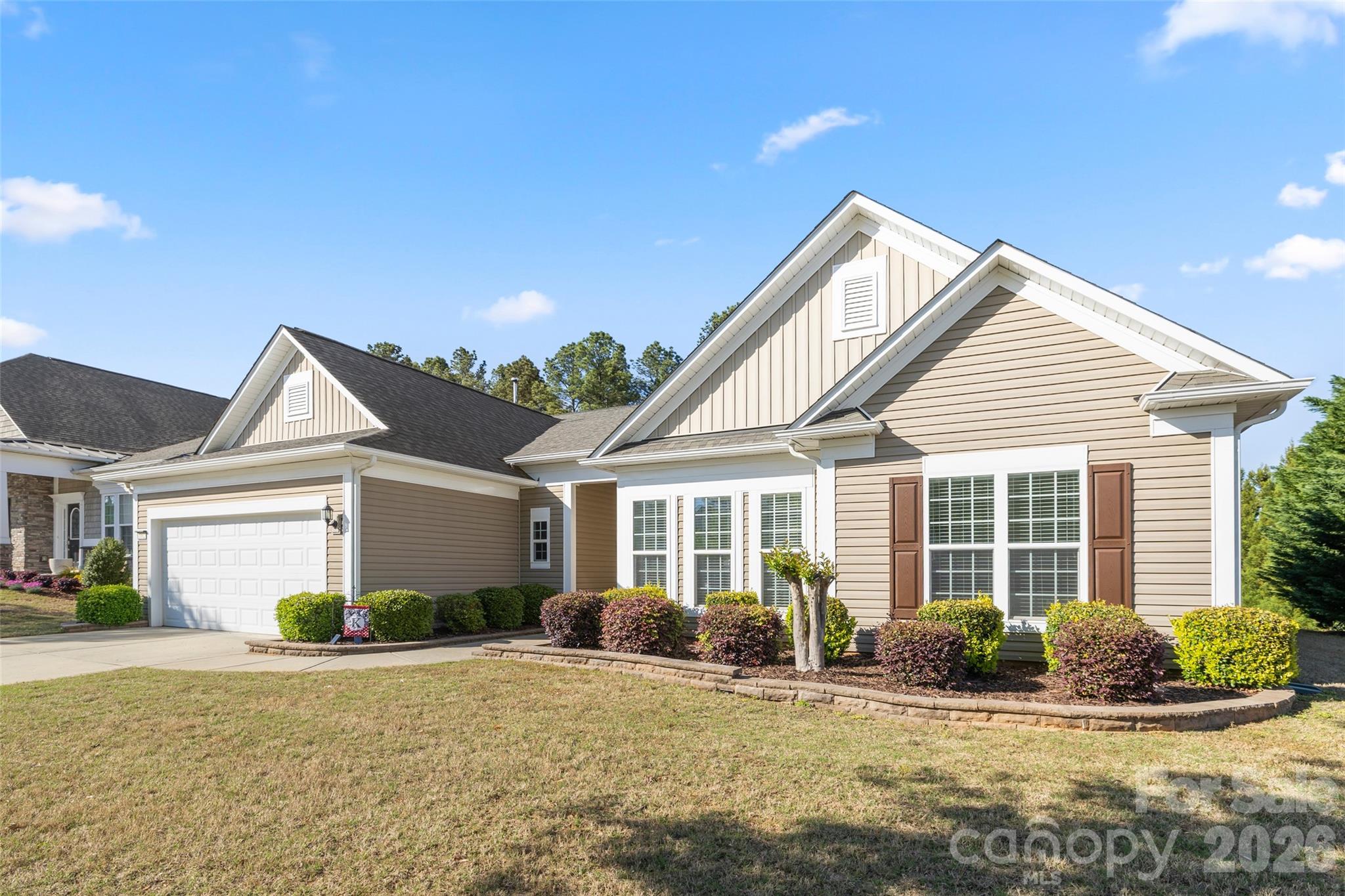 1002 Falling Leaf Street Indian Land, SC 29707 - Photo 6 of 45 a front view of a house with a yard and potted plants