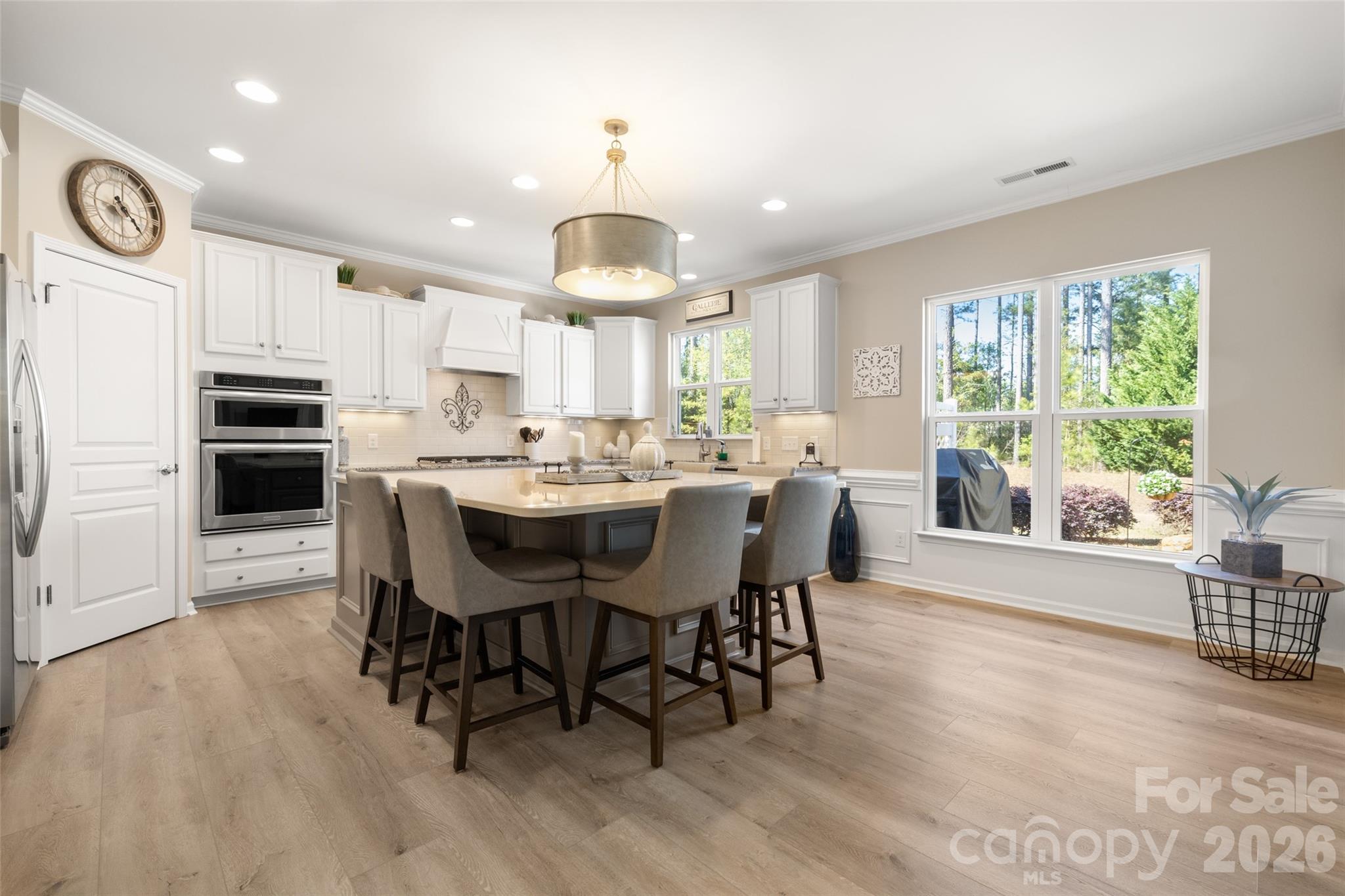 1002 Falling Leaf Street Indian Land, SC 29707 - Photo 9 of 45 a large kitchen with a table and chairs