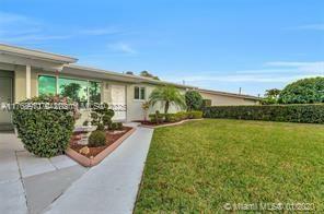 5391 West 9th Lane Hialeah, FL 33012 - Photo 13 of 22 a view of a house with garden and balcony