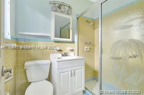 5391 West 9th Lane Hialeah, FL 33012 - Photo 3 of 22 a bathroom with a toilet sink and shower