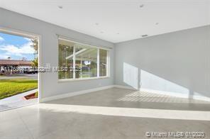 5391 West 9th Lane Hialeah, FL 33012 - Photo 5 of 22 a view of an empty room with a window and balcony