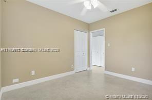 5391 West 9th Lane Hialeah, FL 33012 - Photo 9 of 22 an empty room with a ceiling fan