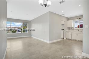 5391 West 9th Lane Hialeah, FL 33012 - Photo 10 of 22 a view of a kitchen with a sink and dishwasher cabinet