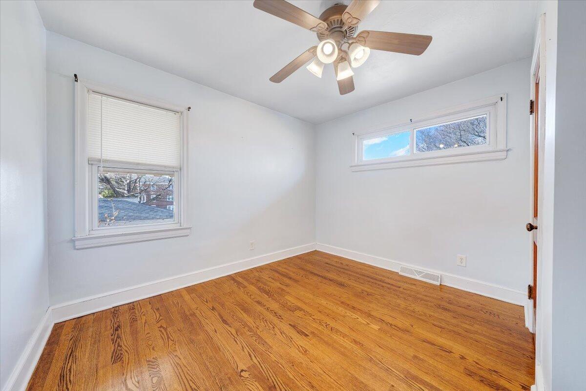2346 Berkley Avenue Southwest Roanoke, VA 24015 - Photo 11 of 50 a view of an empty room with a window and a painting on the wall