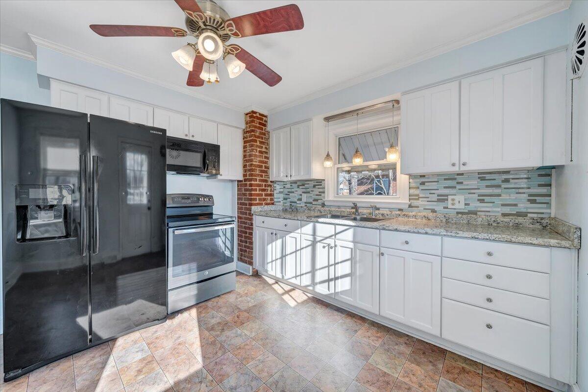 2346 Berkley Avenue Southwest Roanoke, VA 24015 - Photo 17 of 50 a kitchen with granite countertop a refrigerator and a sink