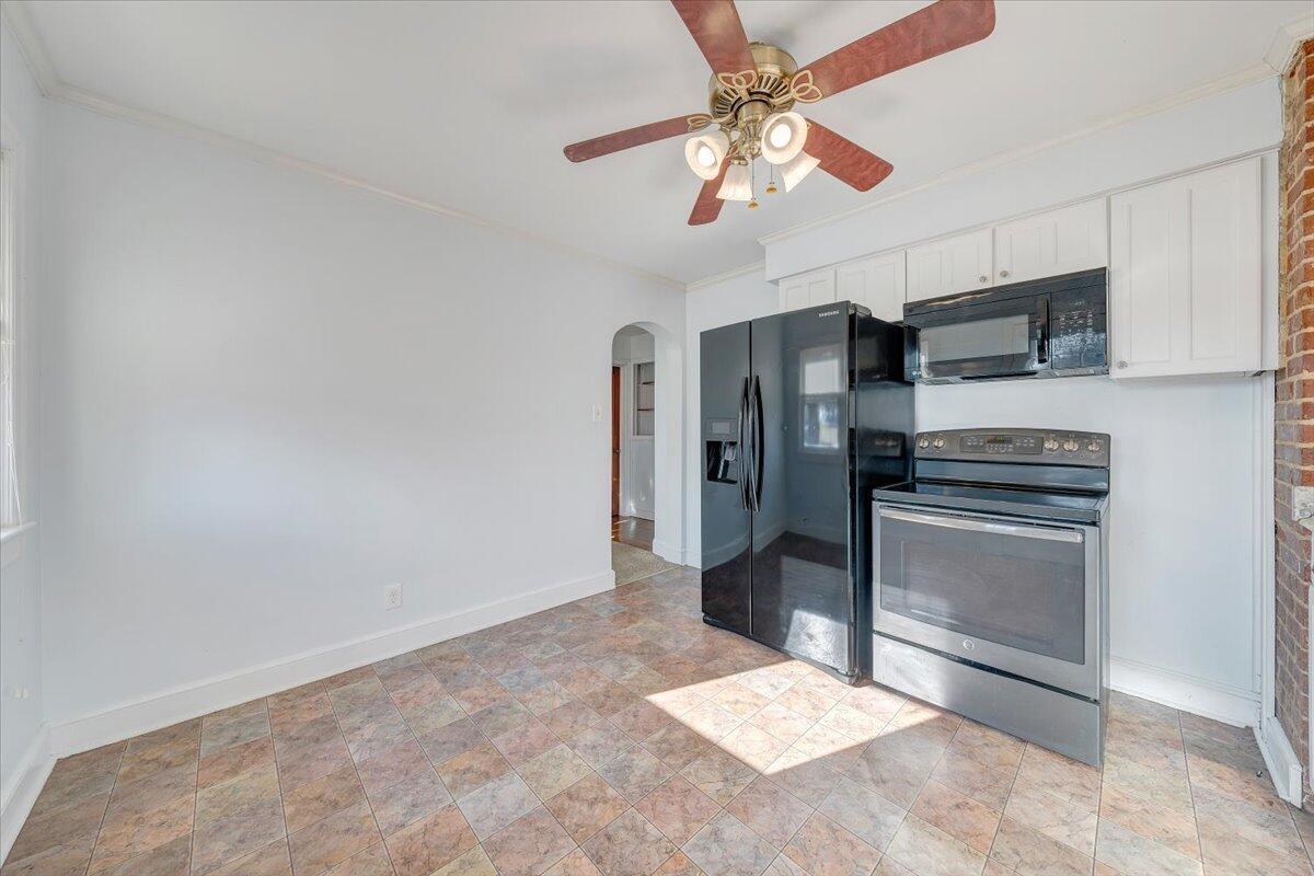 2346 Berkley Avenue Southwest Roanoke, VA 24015 - Photo 19 of 50 a kitchen with stainless steel appliances a refrigerator and a stove top oven