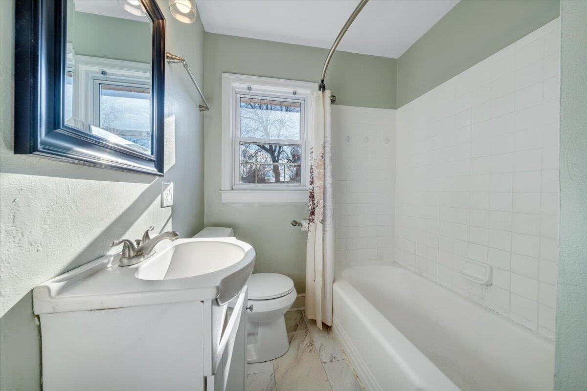 2346 Berkley Avenue Southwest Roanoke, VA 24015 - Photo 20 of 50 a bathroom with a sink a toilet and shower