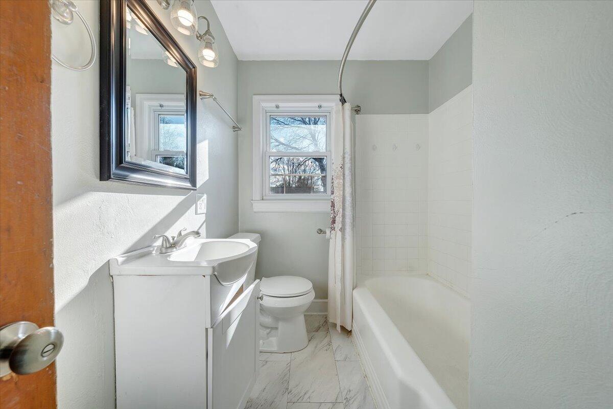 2346 Berkley Avenue Southwest Roanoke, VA 24015 - Photo 21 of 50 a bathroom with a sink a toilet and shower