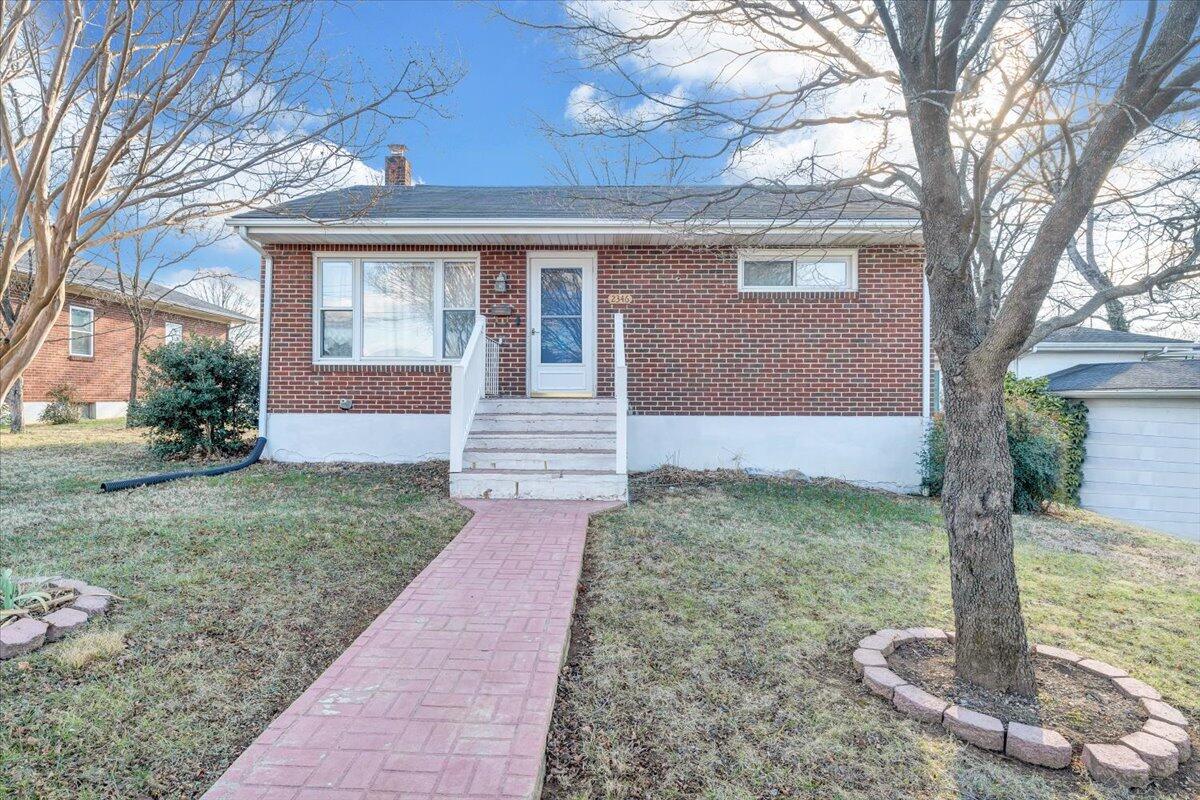 2346 Berkley Avenue Southwest Roanoke, VA 24015 - Photo 3 of 50 a front view of a house with garden