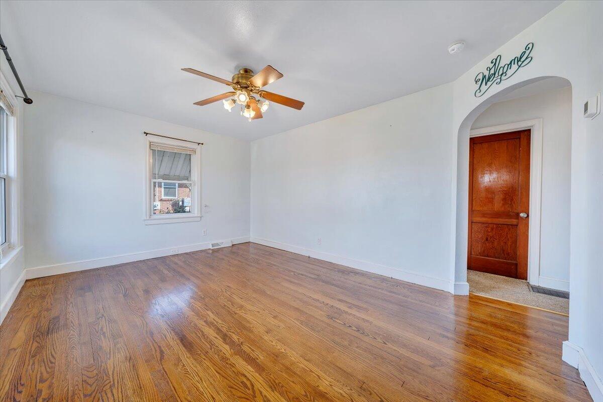 2346 Berkley Avenue Southwest Roanoke, VA 24015 - Photo 4 of 50 wooden floor in an empty room with a window