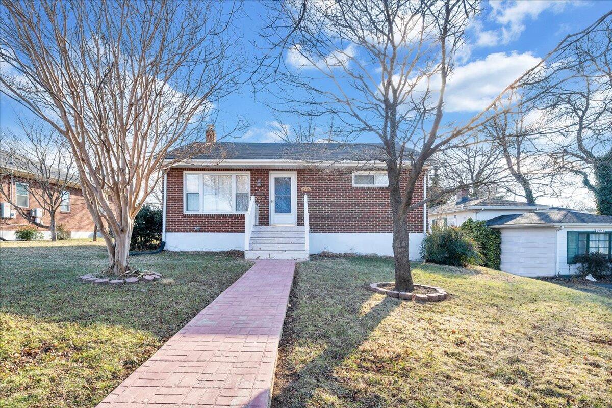 2346 Berkley Avenue Southwest Roanoke, VA 24015 - Photo 45 of 50 a front view of a house with a yard and trees