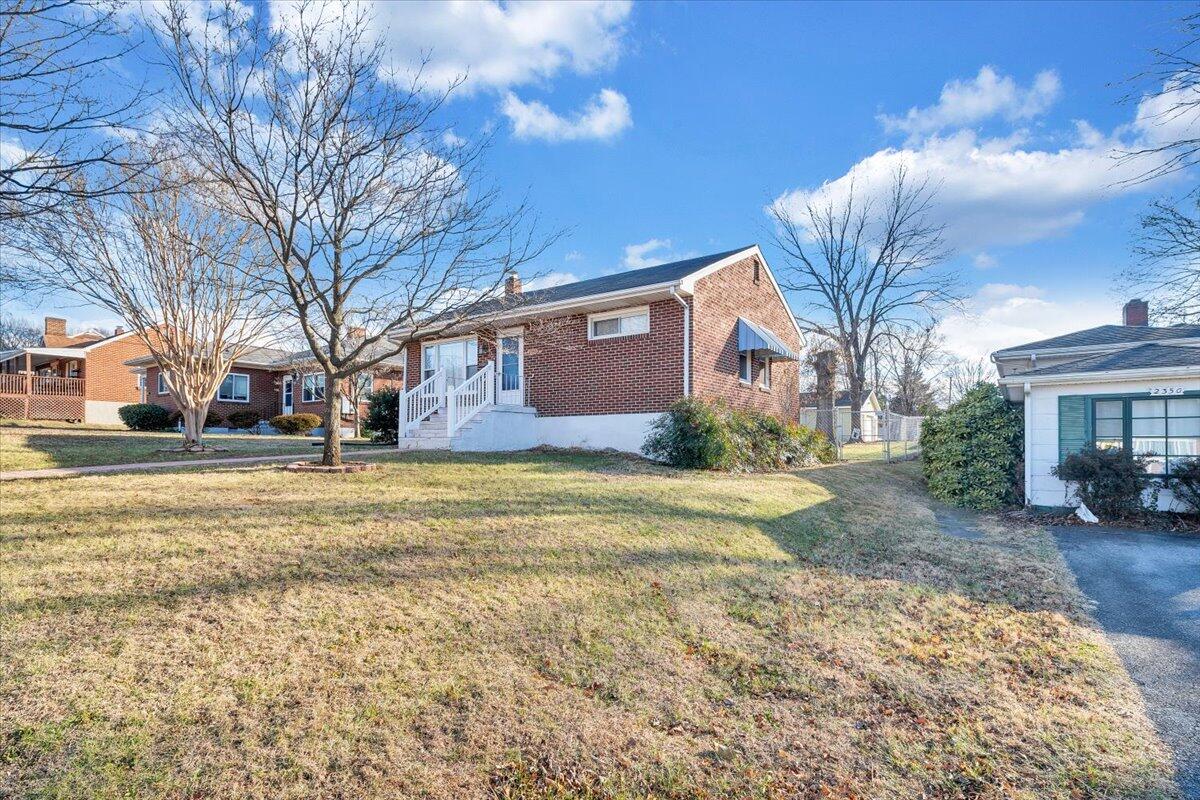 2346 Berkley Avenue Southwest Roanoke, VA 24015 - Photo 47 of 50 a front view of house with yard and trees around