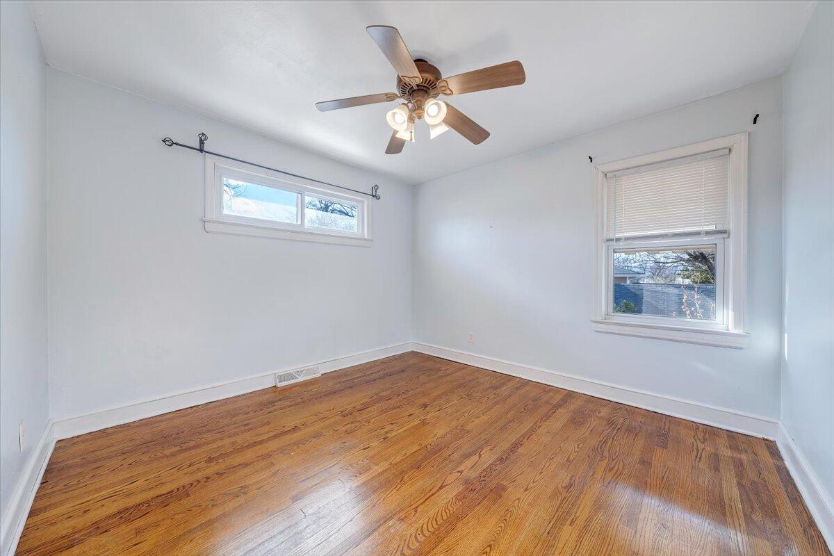 2346 Berkley Avenue Southwest Roanoke, VA 24015 - Photo 8 of 50 a view of an empty room with wooden floor