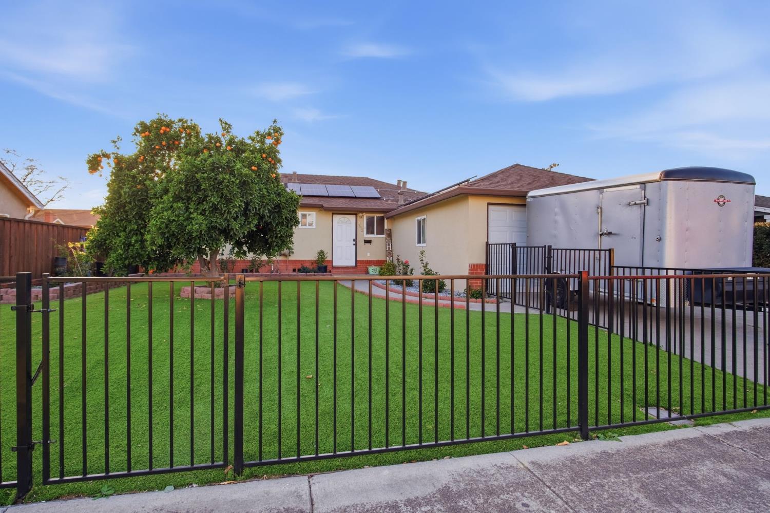 355 Harding Avenue Manteca, CA 95336 - Photo 1 of 21 a view of a house with a garden and plants