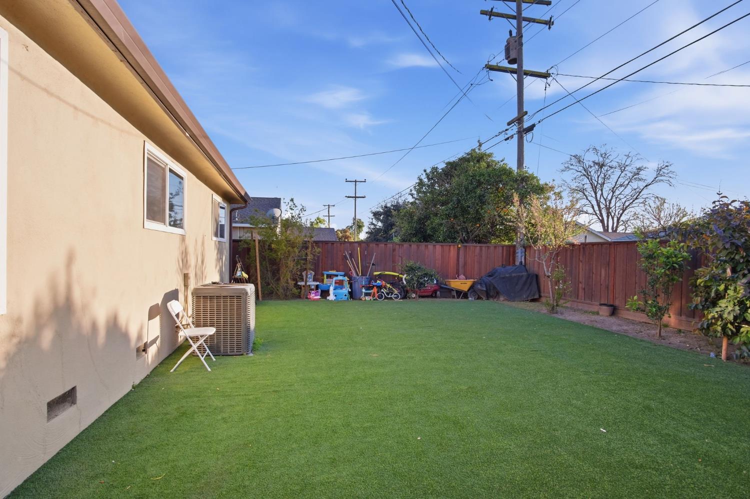 355 Harding Avenue Manteca, CA 95336 - Photo 16 of 21 a view of backyard with hardwood and deck