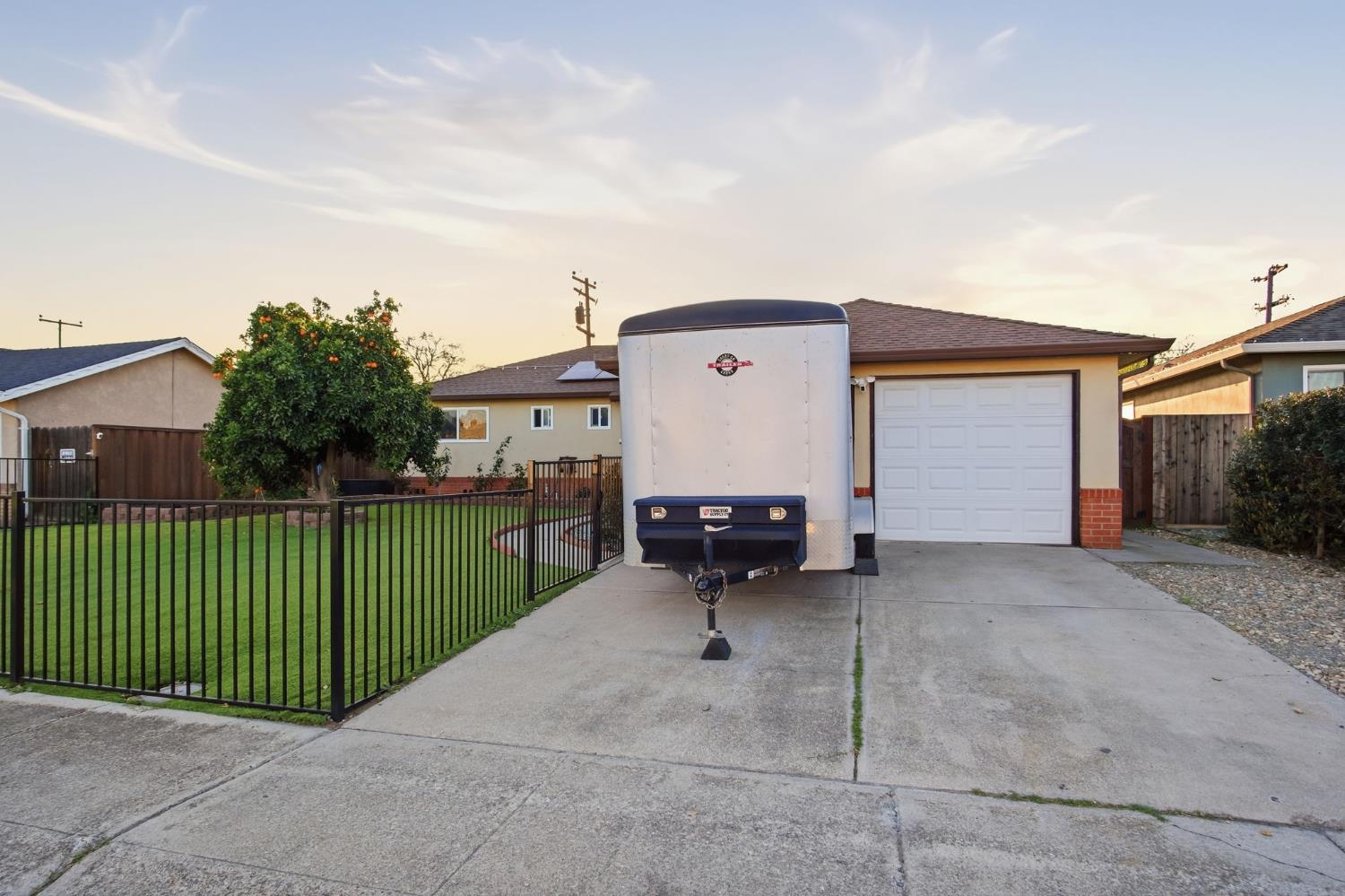 355 Harding Avenue Manteca, CA 95336 - Photo 3 of 21 a view of a house with a yard and sitting area