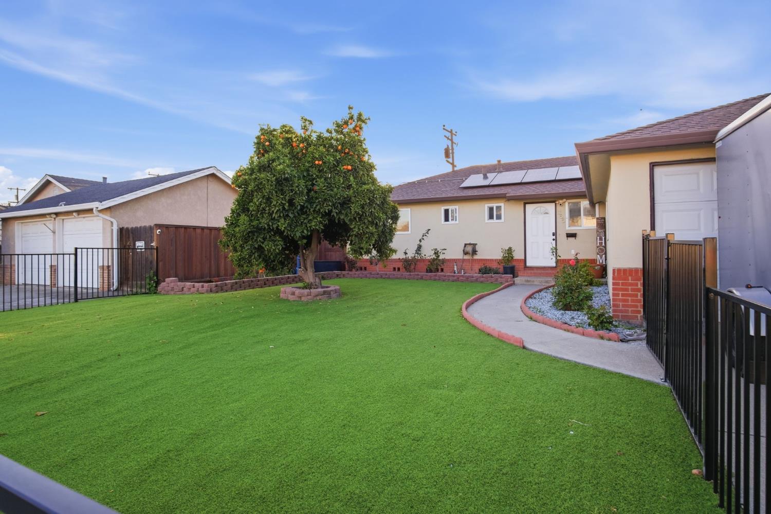 355 Harding Avenue Manteca, CA 95336 - Photo 4 of 21 a view of a house with backyard and porch