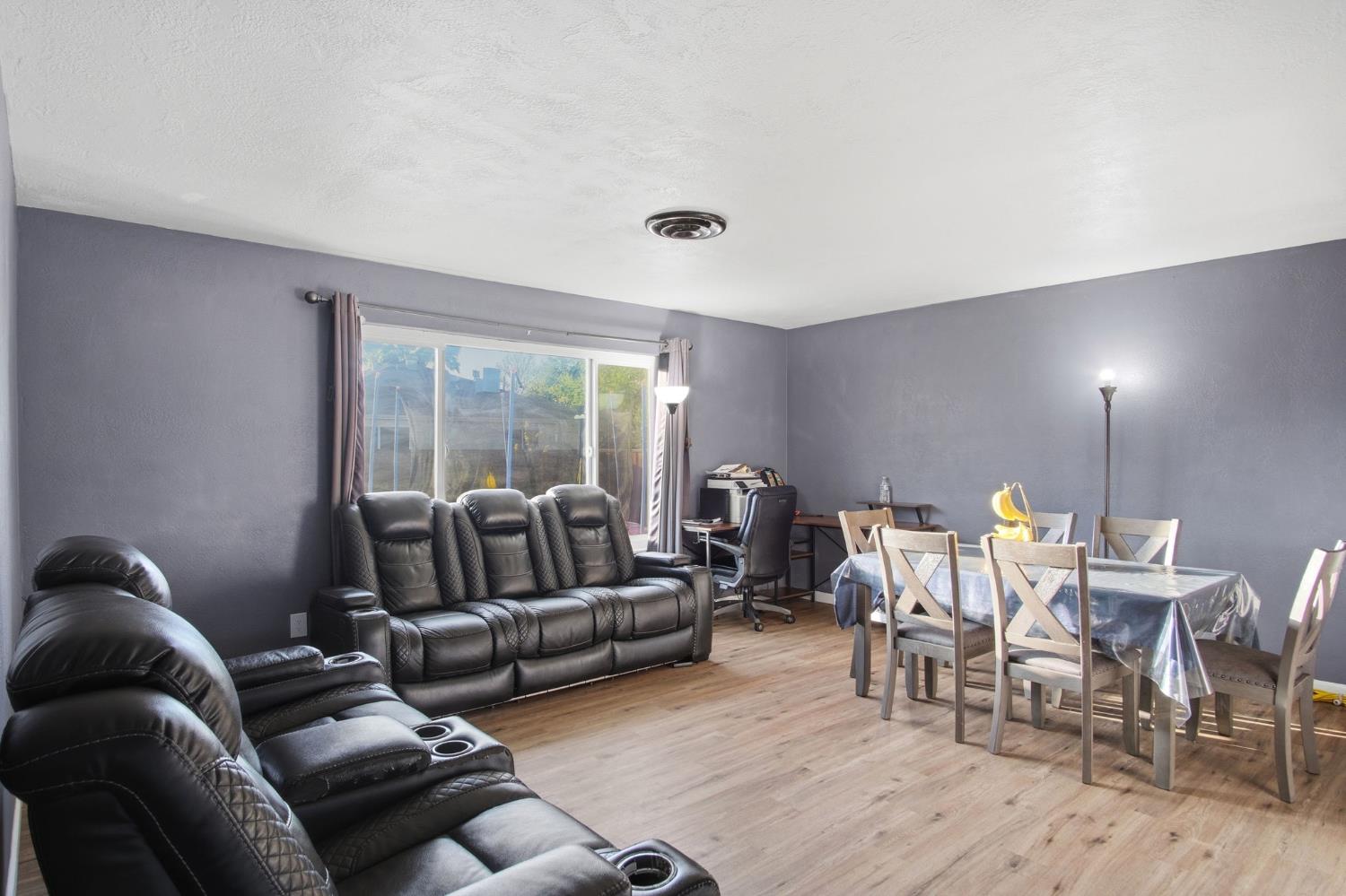 355 Harding Avenue Manteca, CA 95336 - Photo 5 of 21 a living room with furniture and a large window