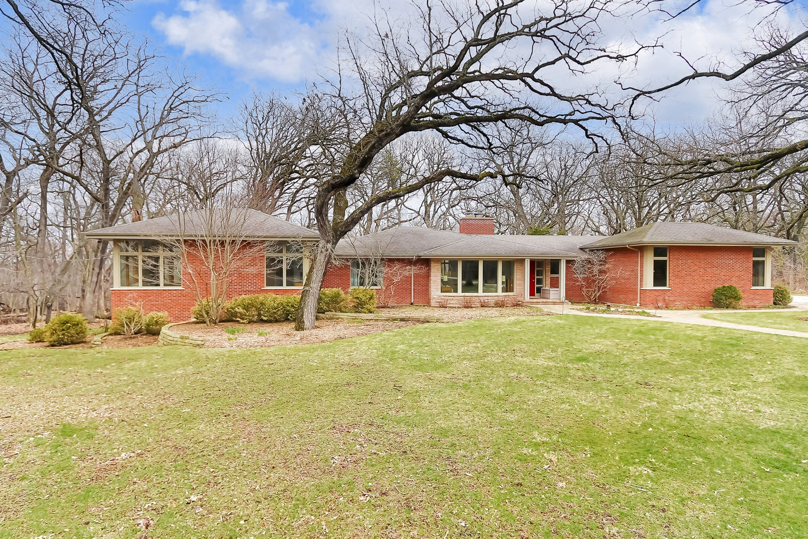 a front view of a house with a yard