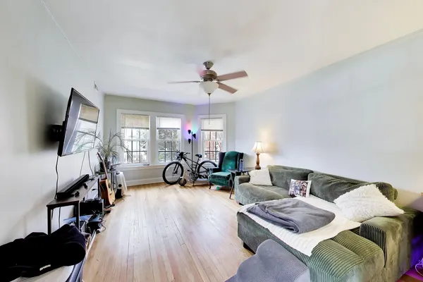 a view of a livingroom with furniture and a flat screen tv