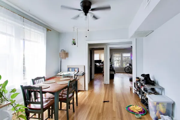 a view of a dining room with furniture and wooden floor
