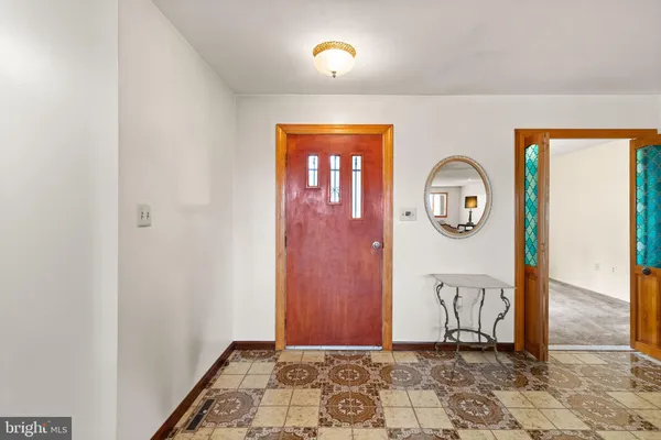 a view of a room with a door and a shower