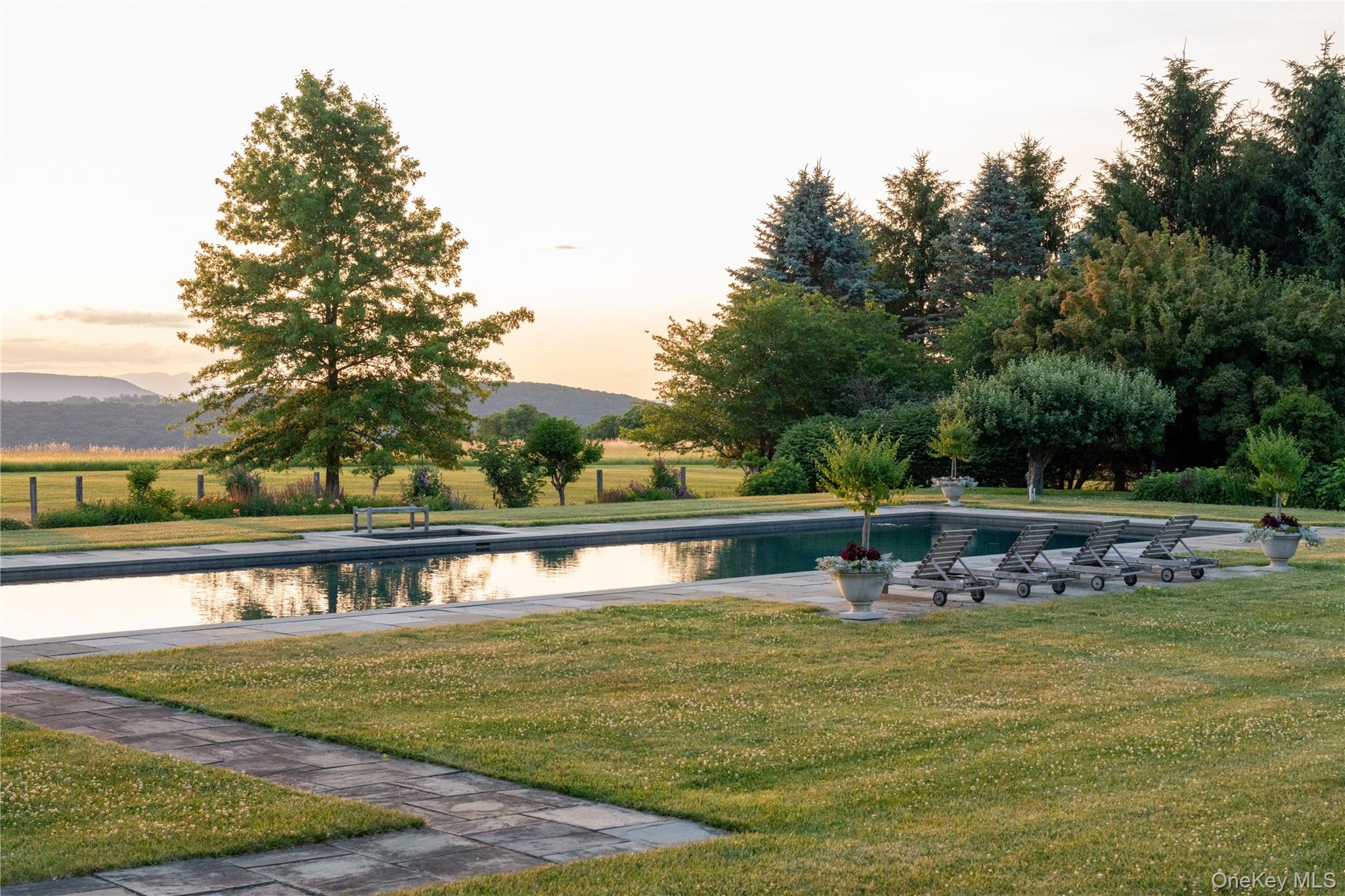 147 Moadock Road Millerton, NY 12546 - Photo 41 of 50 a view of a house with a yard and sitting area
