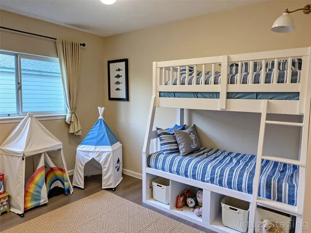 a bedroom with furniture and a book shelf