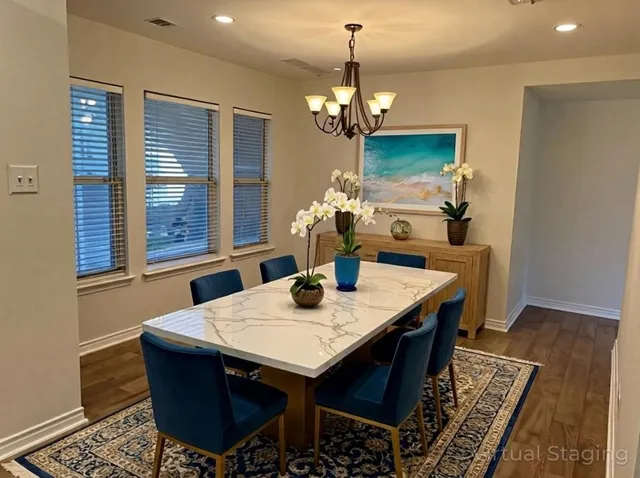 a view of a dining room with furniture window and wooden floor