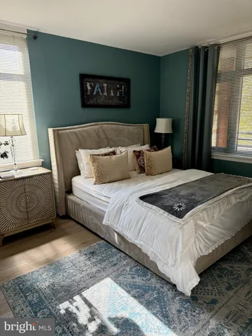 a bedroom with bed and window