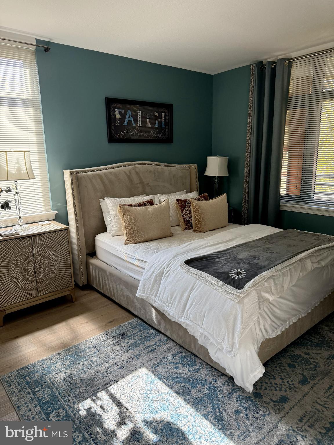 1117 10th Street Northwest, Unit 301 Washington, DC 20001 - Photo 17 of 38 a bedroom with bed and window