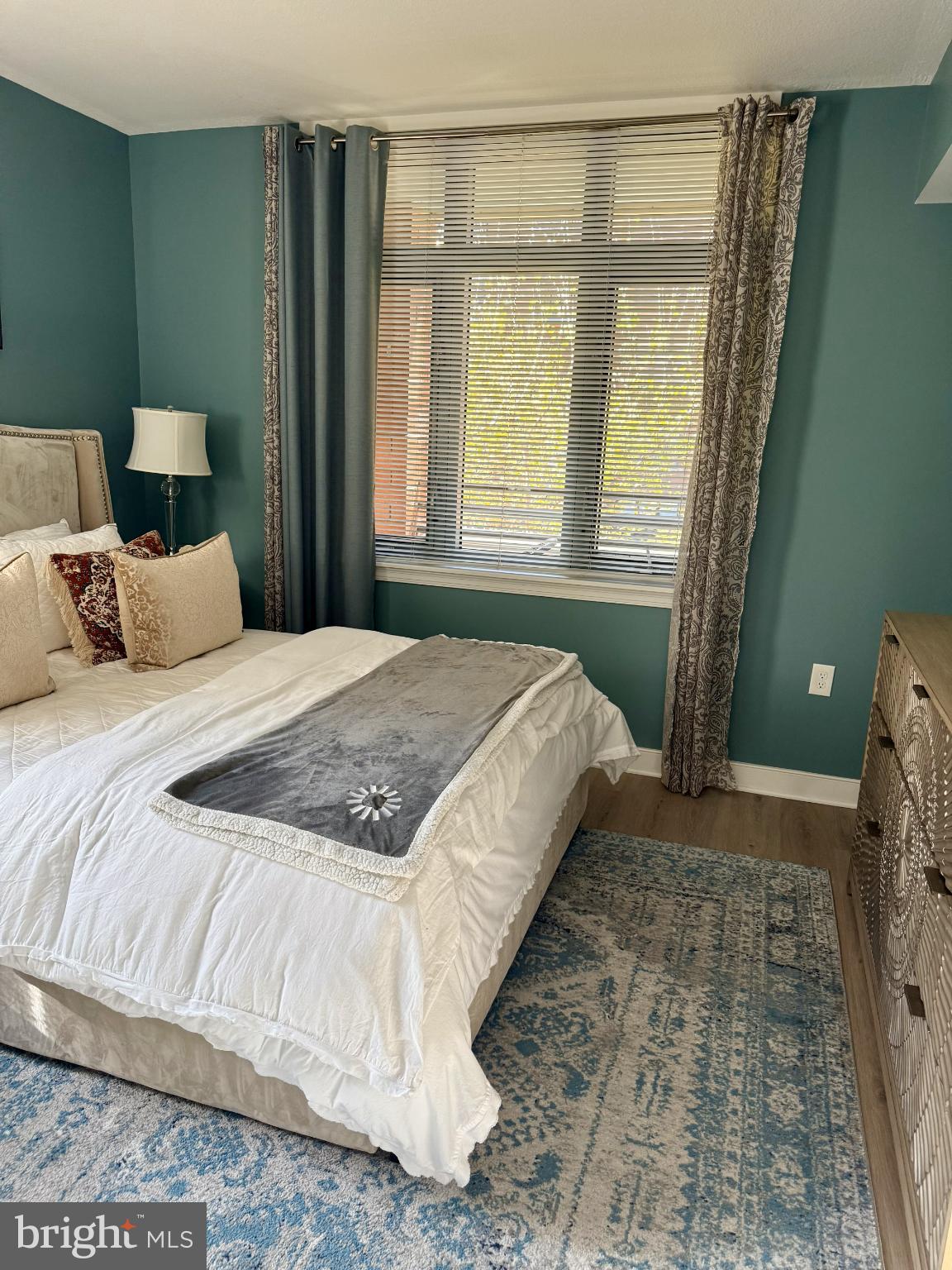 1117 10th Street Northwest, Unit 301 Washington, DC 20001 - Photo 18 of 38 a bedroom with a bed and a window