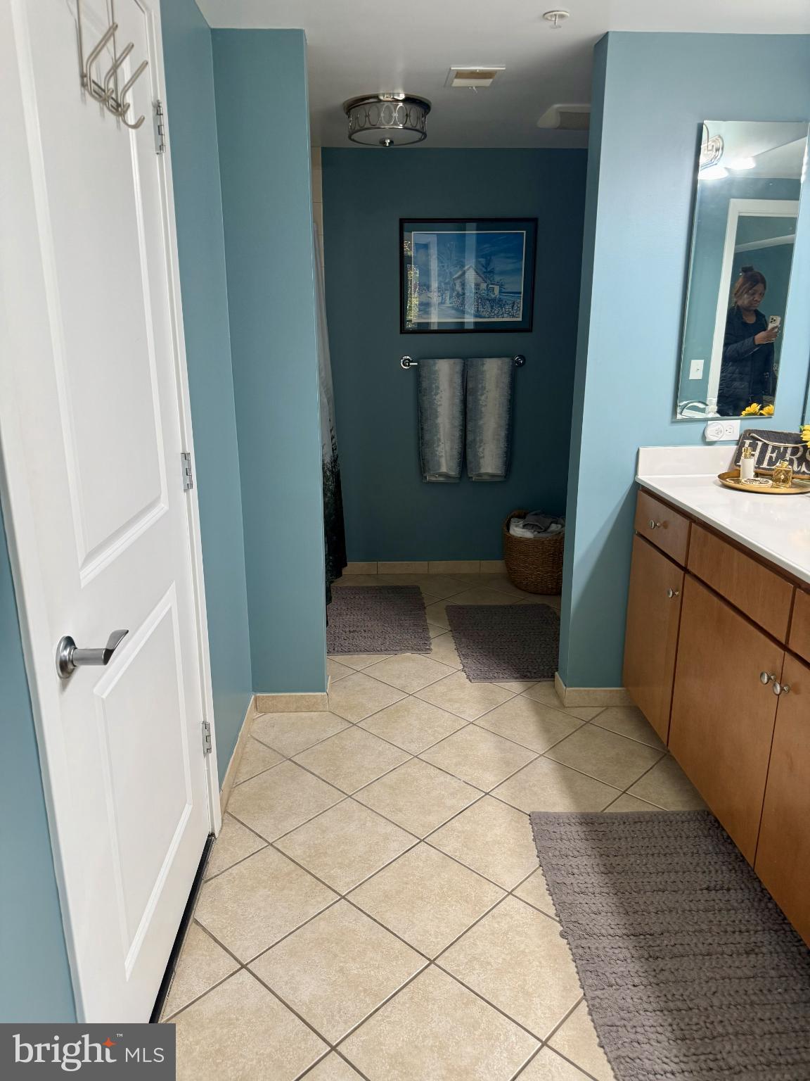 1117 10th Street Northwest, Unit 301 Washington, DC 20001 - Photo 19 of 38 a bathroom with a sink a toilet and a mirror