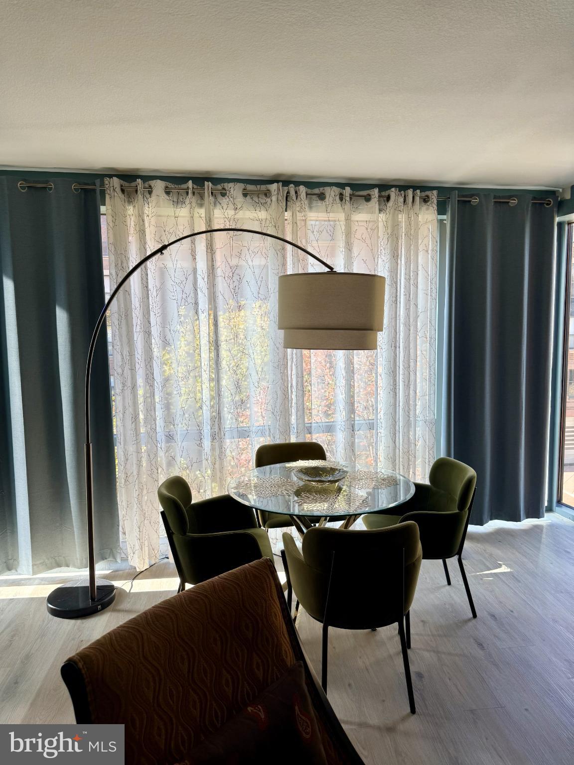 1117 10th Street Northwest, Unit 301 Washington, DC 20001 - Photo 24 of 38 a view of a dining room with furniture and window