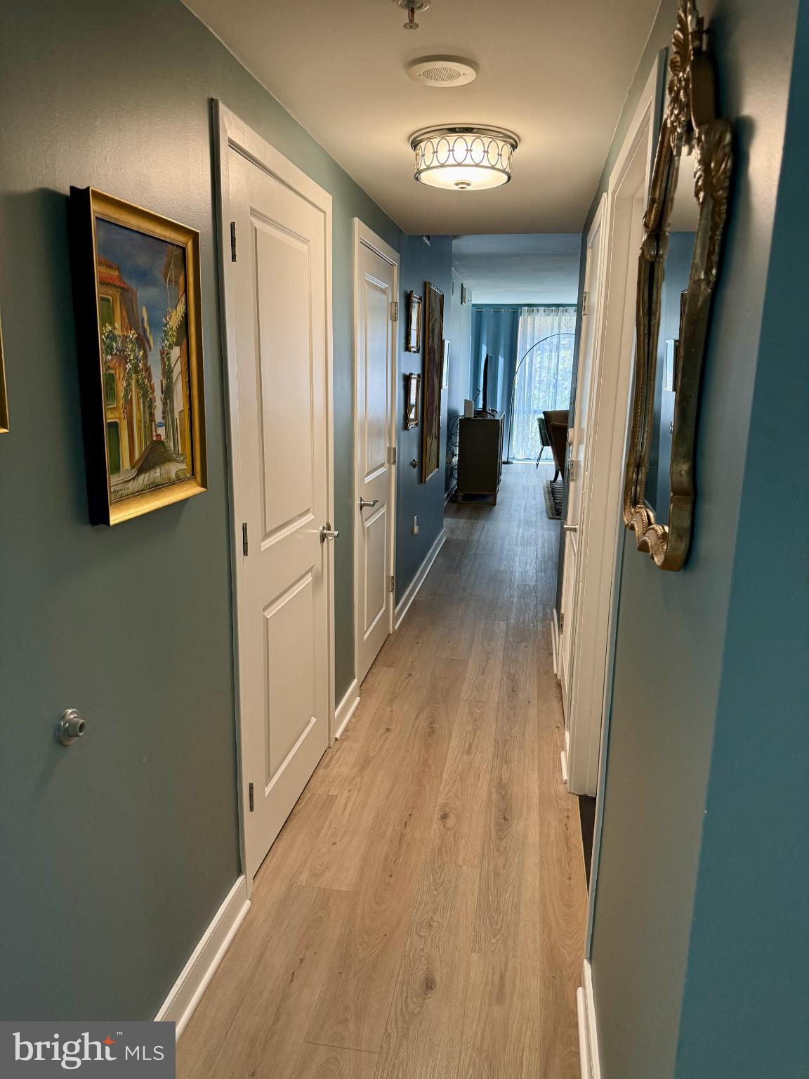1117 10th Street Northwest, Unit 301 Washington, DC 20001 - Photo 3 of 38 a view of a hallway with wooden floor