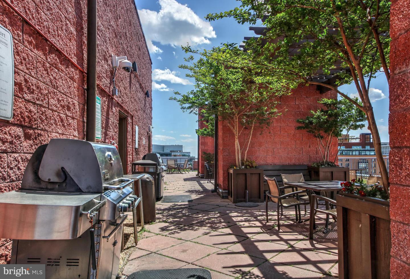 1117 10th Street Northwest, Unit 301 Washington, DC 20001 - Photo 33 of 38 a view of a dinning tables and chairs in a patio