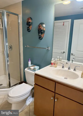 a bathroom with a sink mirror vanity and toilet