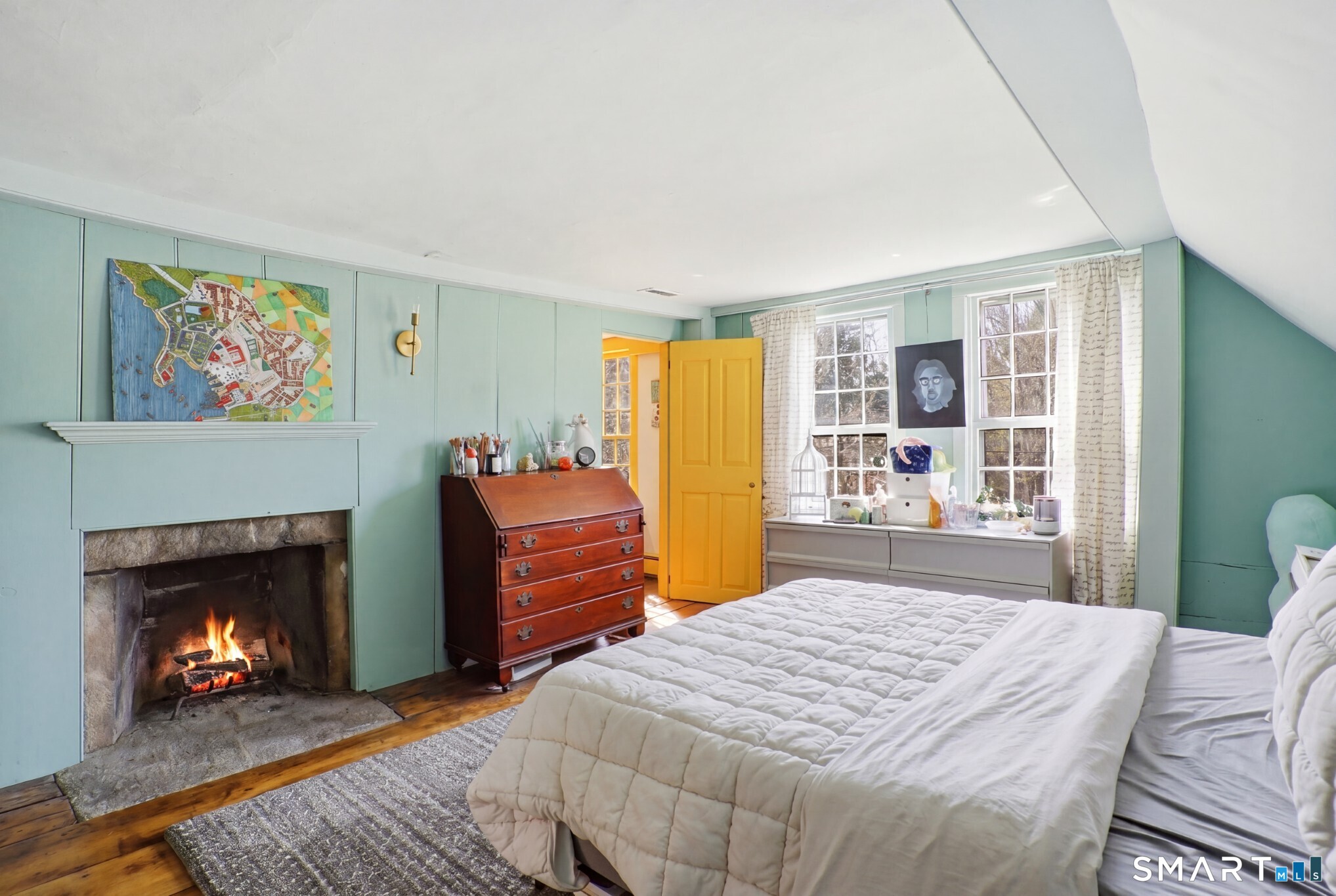 604 Pendleton Hill Road North Stonington, CT 06359 - Photo 29 of 39 a bedroom with a bed and a fireplace