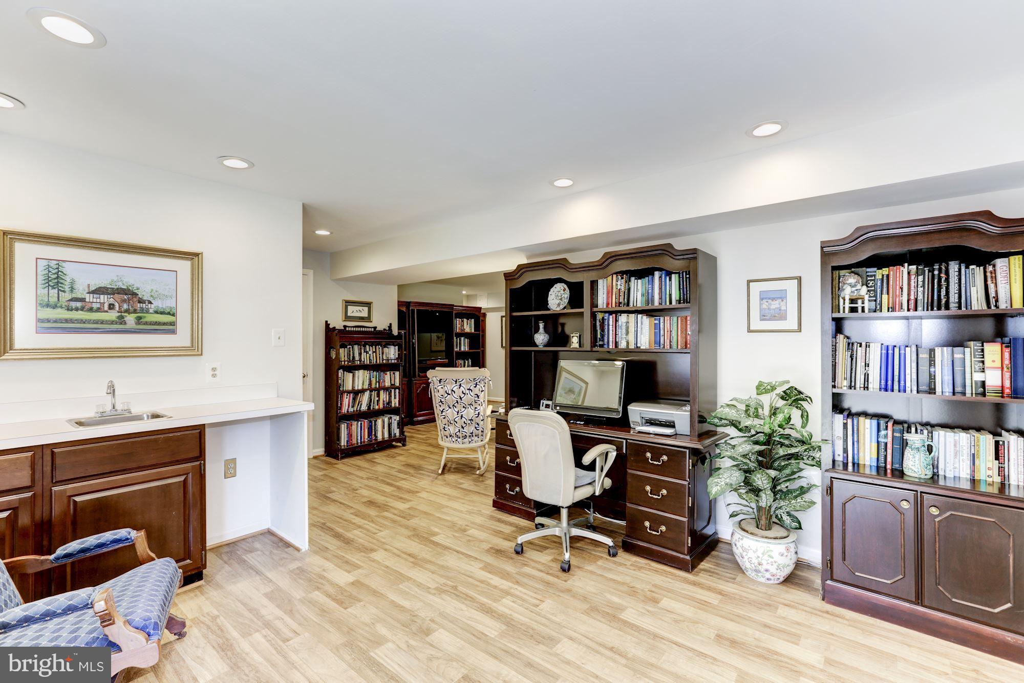 11677 Bennington Woods Road Reston, VA 20194 - Photo 40 of 51 Wet bar in lower level den with cedar closets