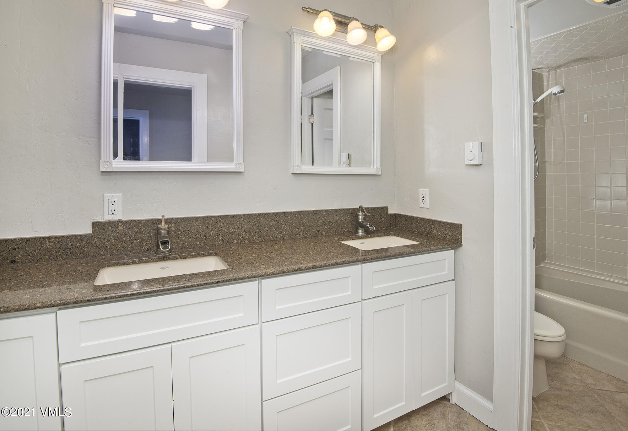 211 Nottingham Road, Unit F Avon, CO 81620 - Photo 11 of 26 a bathroom with a sink and a mirror