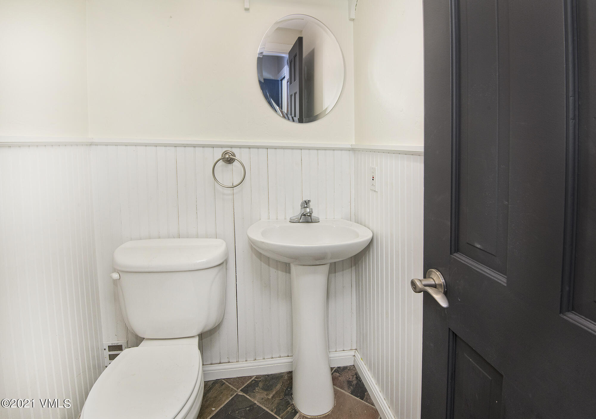 211 Nottingham Road, Unit F Avon, CO 81620 - Photo 17 of 26 a bathroom with a toilet sink and mirror