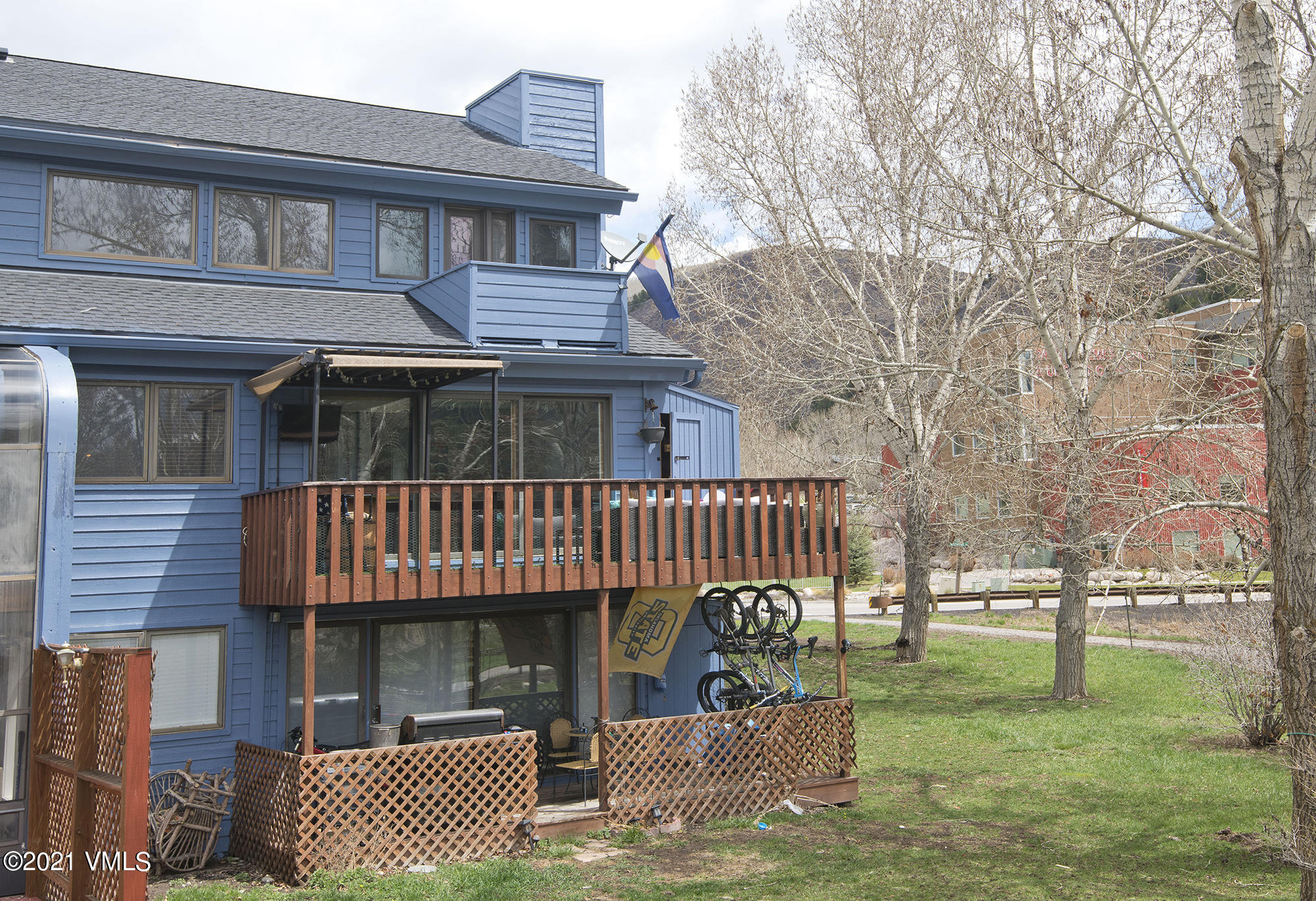 211 Nottingham Road, Unit F Avon, CO 81620 - Photo 25 of 26 a view of a house with a yard and furniture