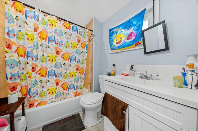 a utility room with stainless steel appliances a stove and a chimney