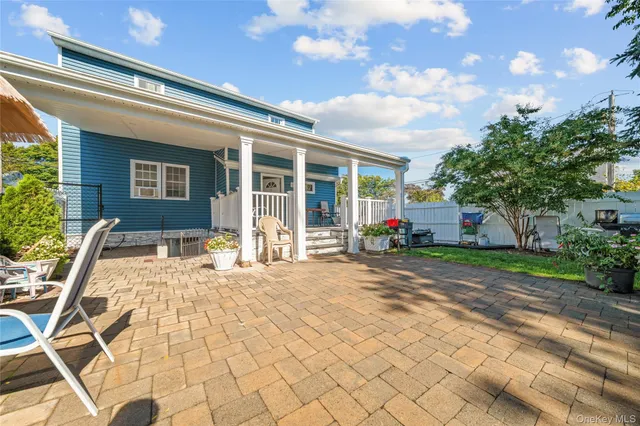 a house view with a sitting space and garden space