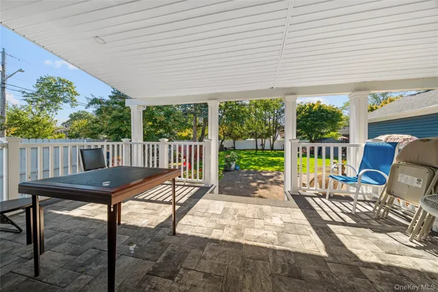 a view of a patio with furniture