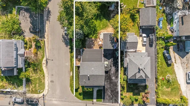 an aerial view of residential houses with outdoor space