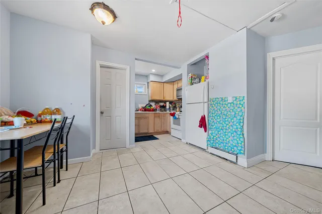 a kitchen with stainless steel appliances kitchen island granite countertop a refrigerator and microwave