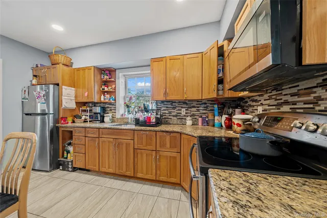 a kitchen with lots of counter top space and cabinets