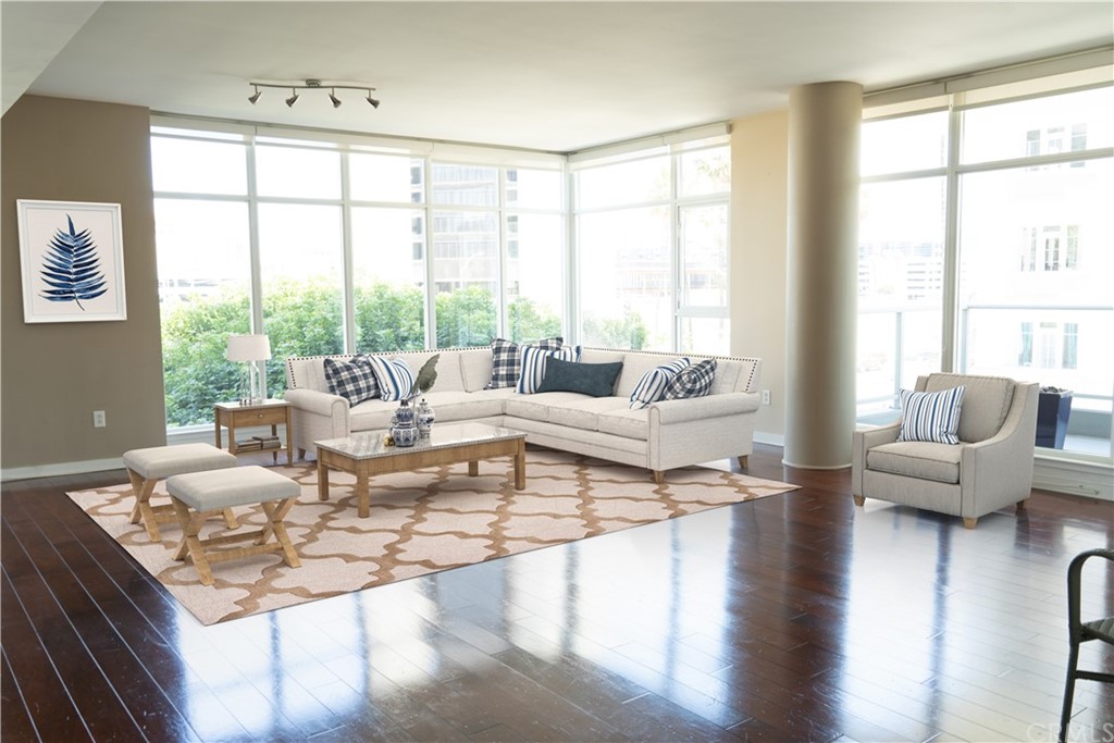 400 West Ocean Boulevard, Unit 206 Long Beach, CA 90802 - Photo 1 of 20 a living room with furniture and a large window