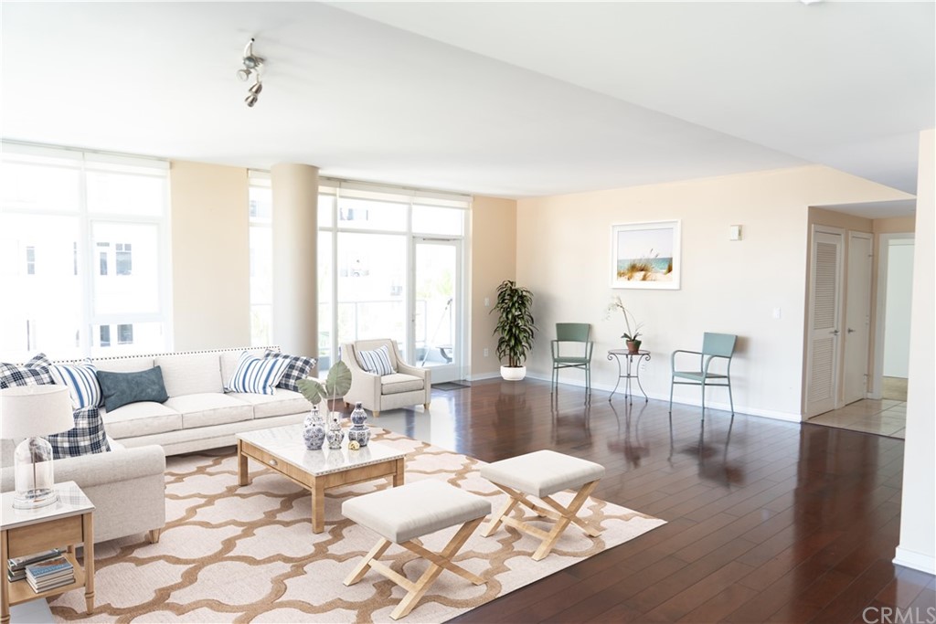 400 West Ocean Boulevard, Unit 206 Long Beach, CA 90802 - Photo 2 of 20 a living room with furniture and a wooden floor